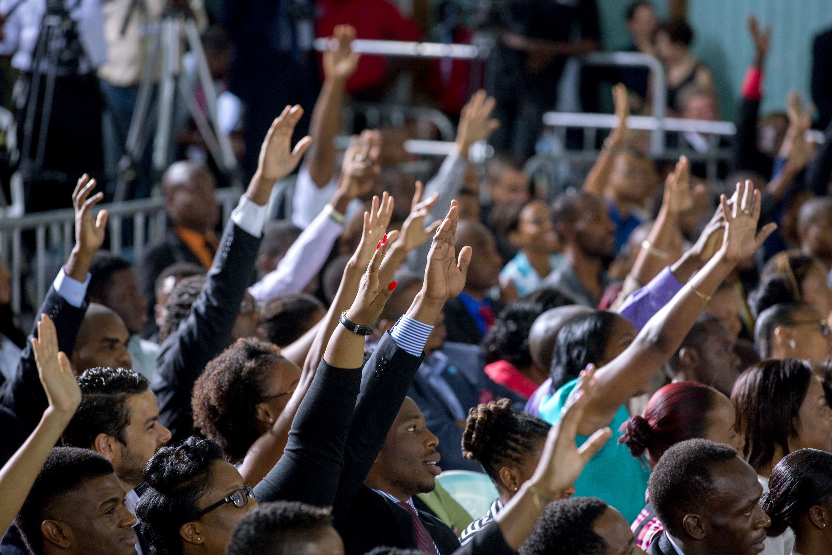 Audience members raise their hand in hopes of being chosen to ask a question at the town hall. (Official White House Photo by Amanda Lucidon)