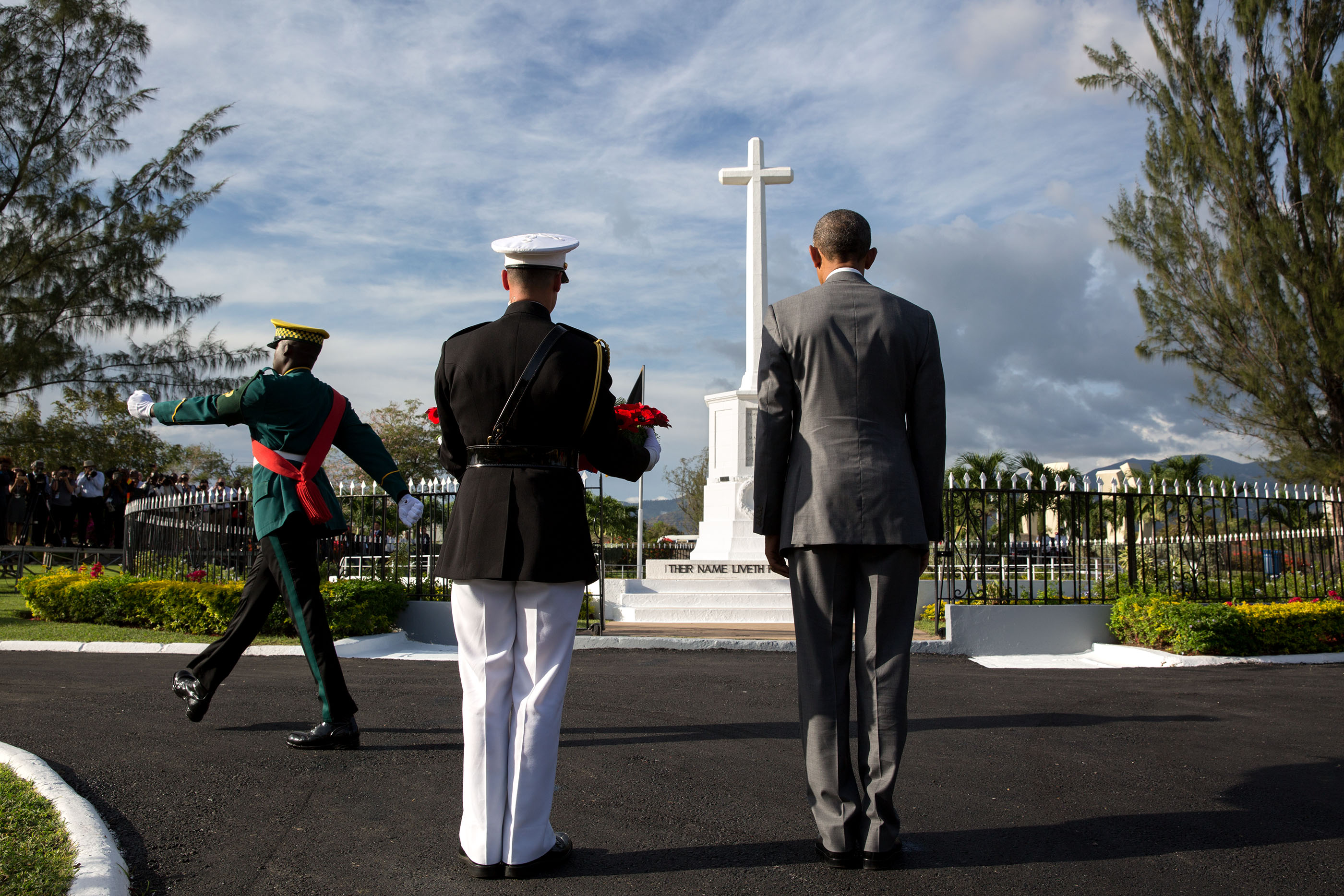 President Obama and Marine Corps military aide Steven Schreiber participate in a wreath laying ceremony at National Heroes Park in Kingston. (Official White House Photo by Pete Souza)