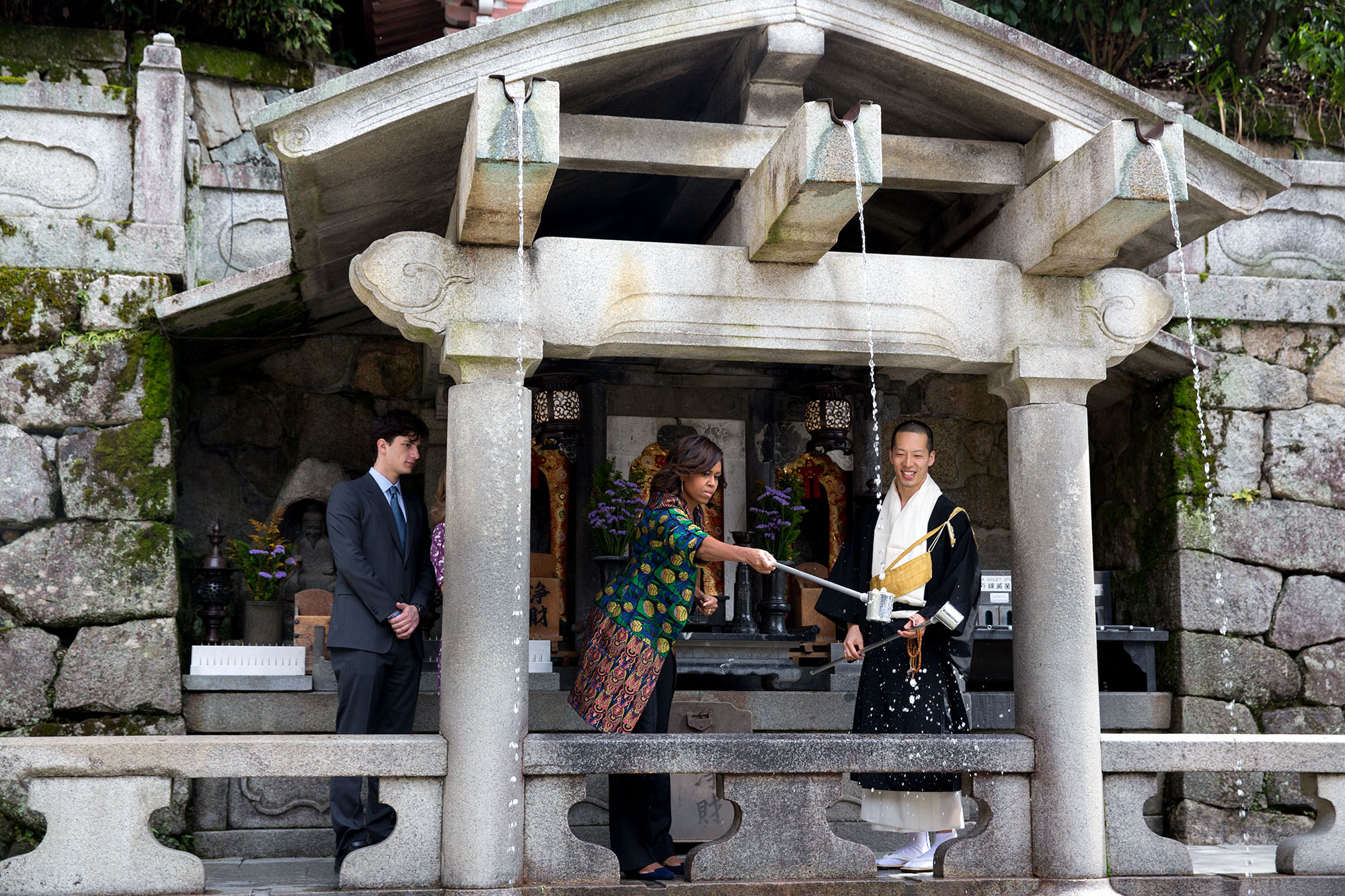 The First Lady participates in the ritual of cleaning the hands and drinking from Otowa Waterfall. (Official White House Photo by Amanda Lucidon)