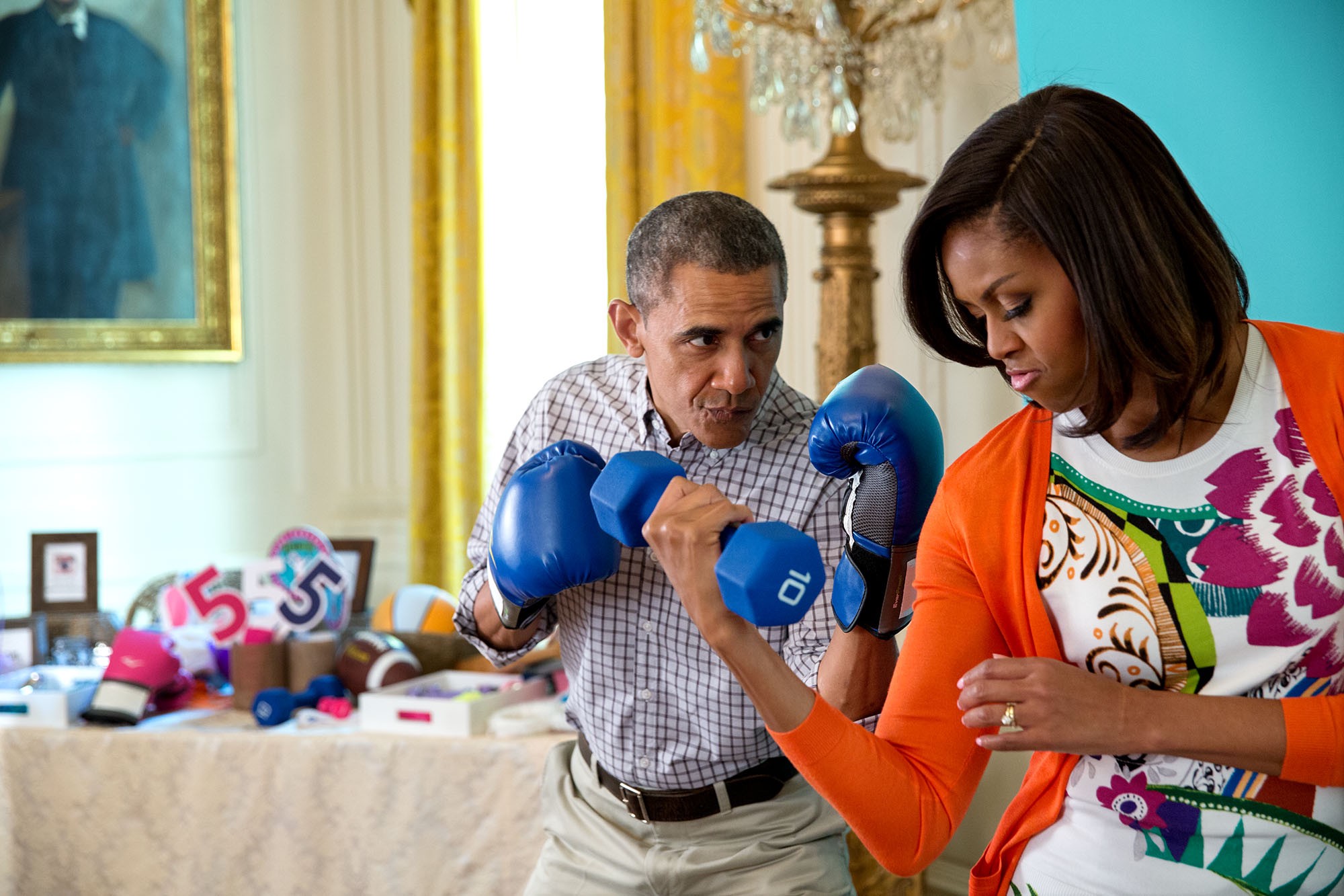 President Barack Obama and First Lady Michelle Obama take photos at the Instagram #GimmeFive photo booth in the East Room prior to the Easter Egg Roll. (Official White House Photo by Pete Souza)