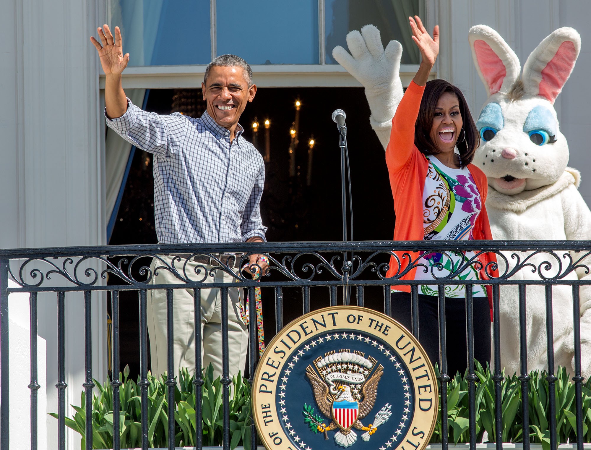 The President and First Lady, with the Easter Bunny, wave from the Blue Room Balcony. (Official White House Photo by David Lienemann)