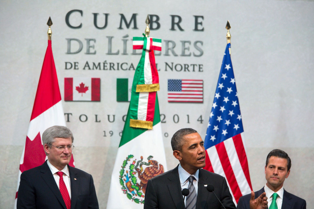 President Barack Obama delivers remarks alongside of President Enrique Peña Nieto and Prime Minister Stephen Harper during the North American Business, Civil Society and Education leaders during the North American Leaders Summit in Toluca, Mexico.