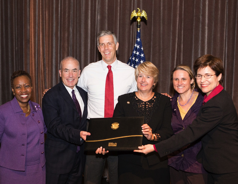 Rev. Brenda Girton-Mitchell, Secretary Arne Duncan, Wendy Spencer, and Melissa Rogers present Loras College a Presidential Award for Interfaith Community Service