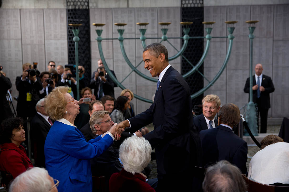 President Barack Obama greets a guest following remarks honoring Swedish diplomat Raoul Wallenberg at the Stockholm Synagogue in Stockholm, Sweden