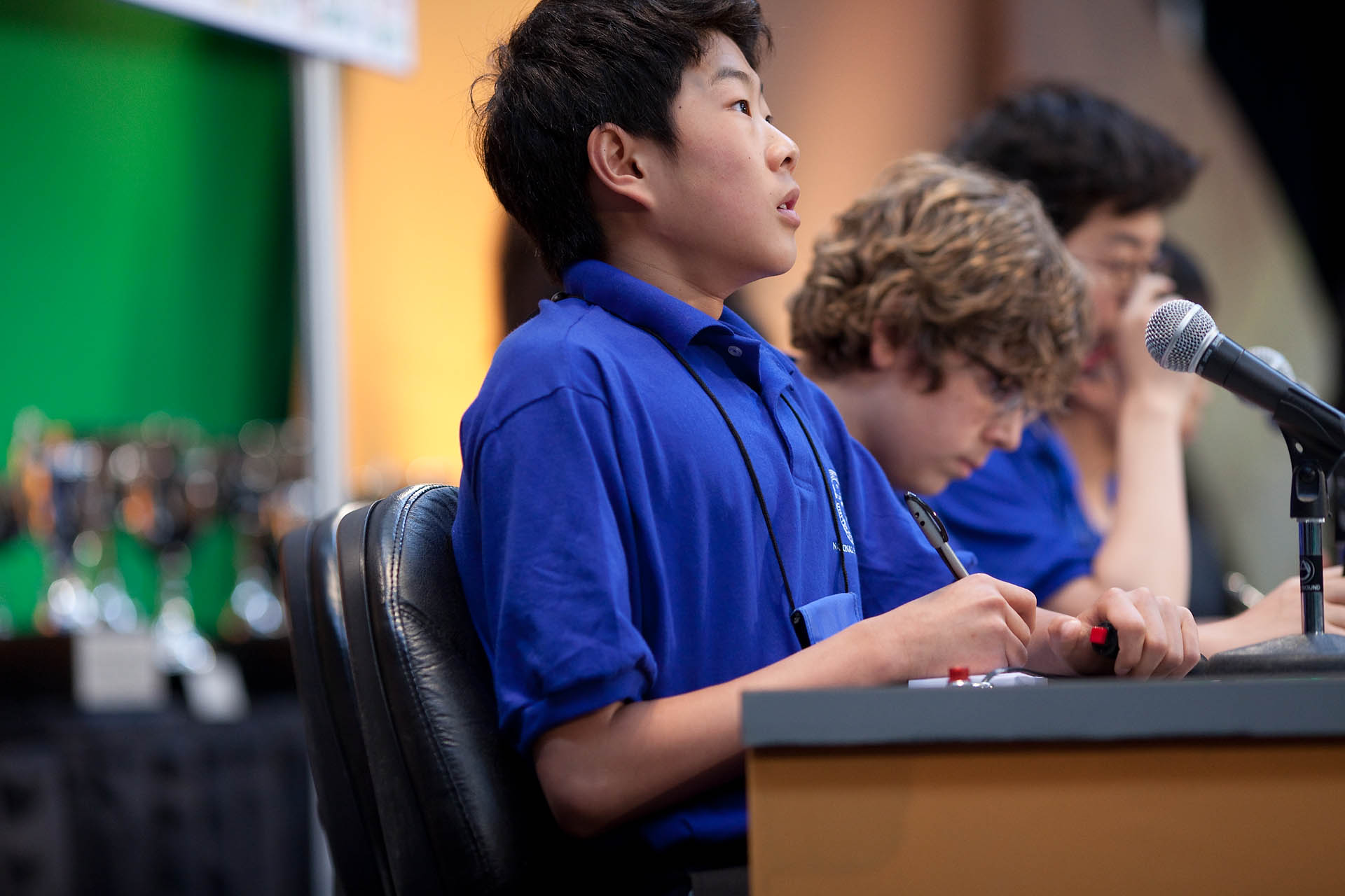 Members of the middle school team from Albuquerque Academy answer a question