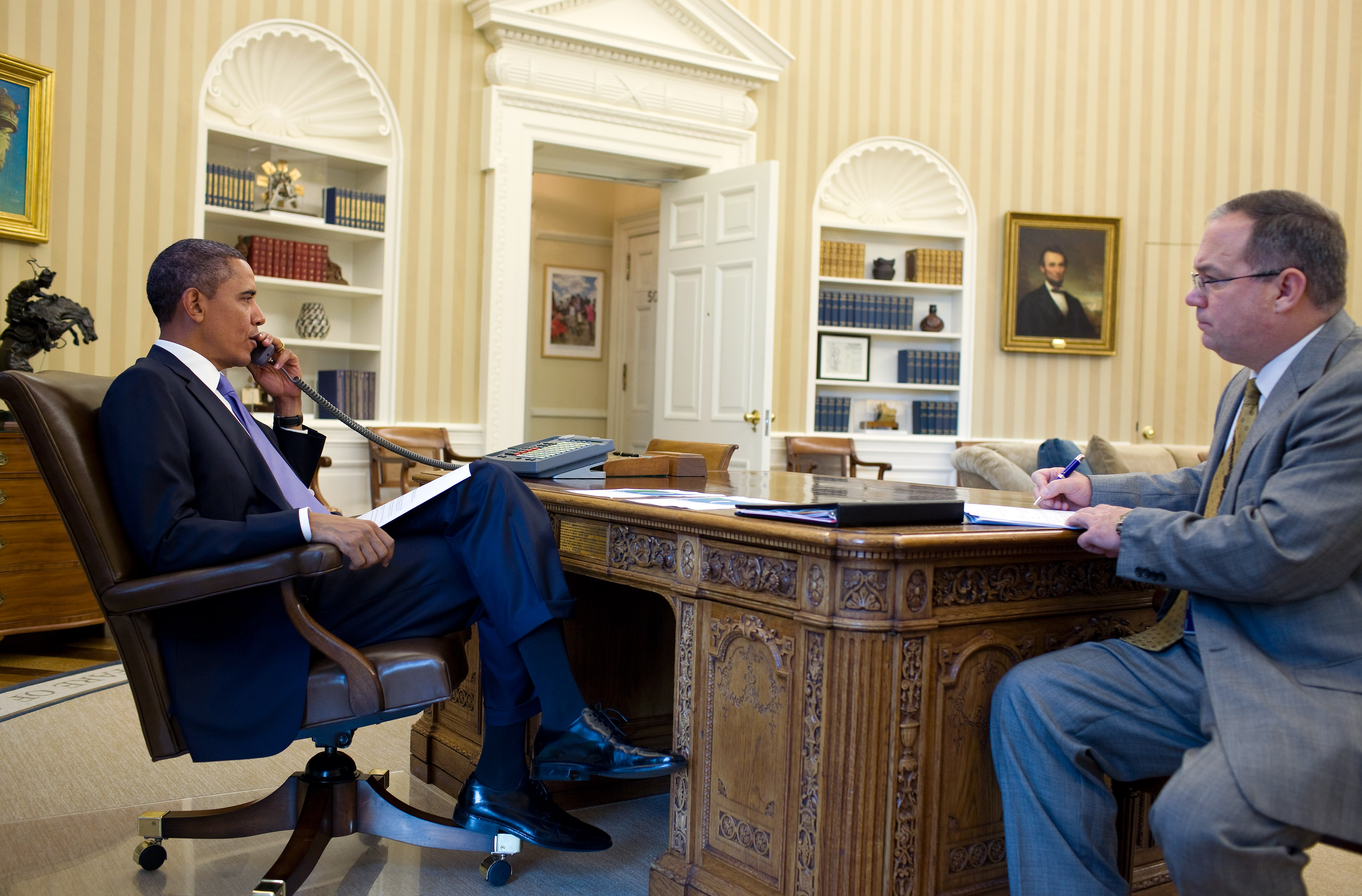 President Barack Obama talks on the phone with FEMA Administrator Craig Fugate