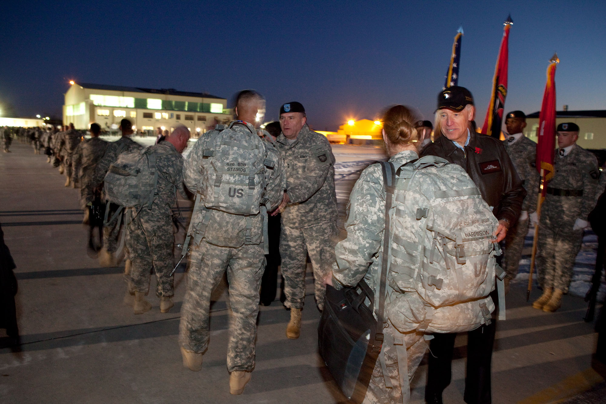 Vice President Joe Biden greets family members before a homecoming ceremony for members of the 3rd Brigade 4