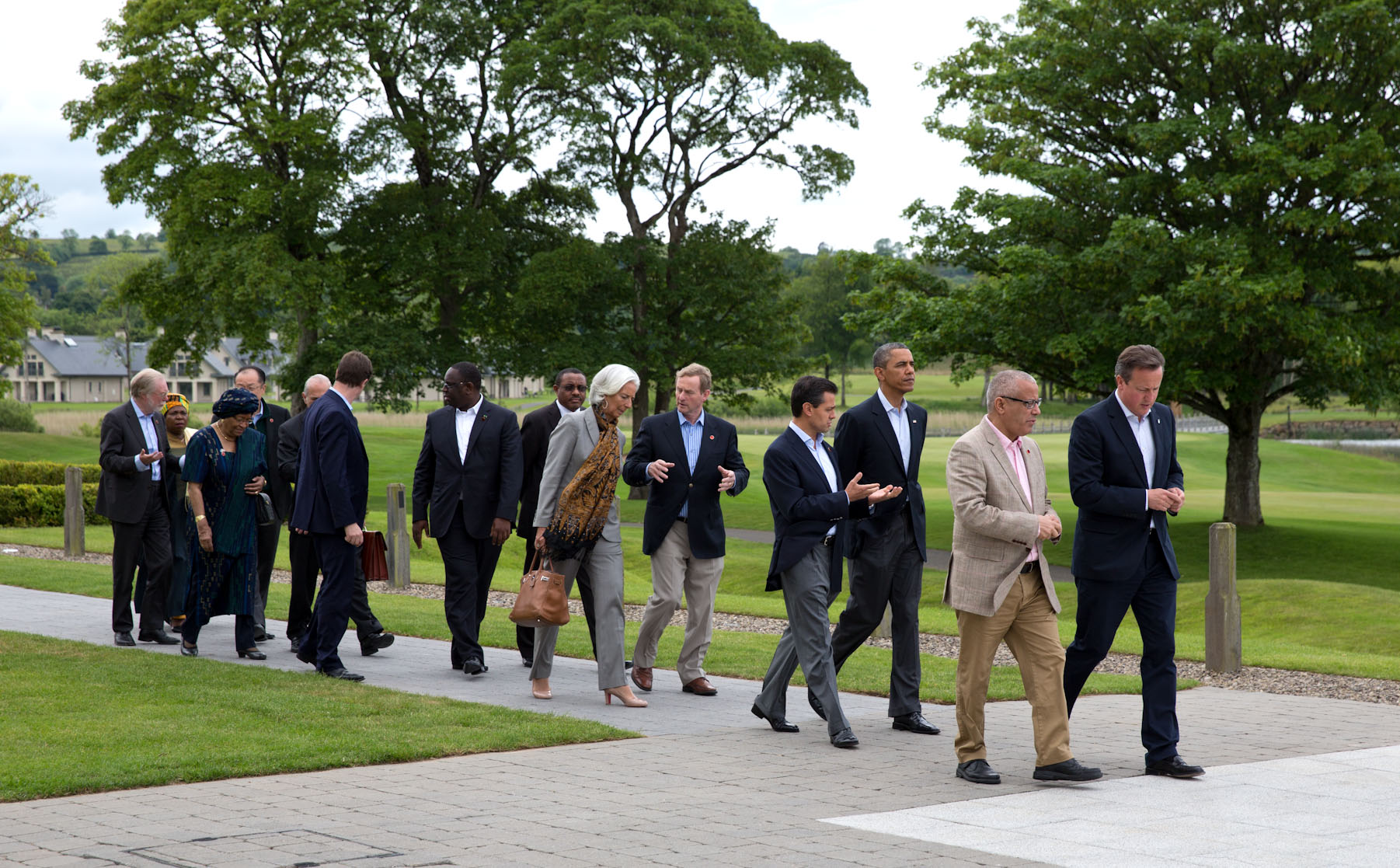 President Barack Obama talks with Mexican President Enrique Pena Nieto as they head to lunch with G8 leaders