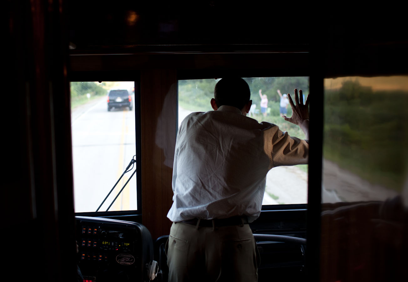 President Obama Waves To People Along The Road In Decorah, Iowa