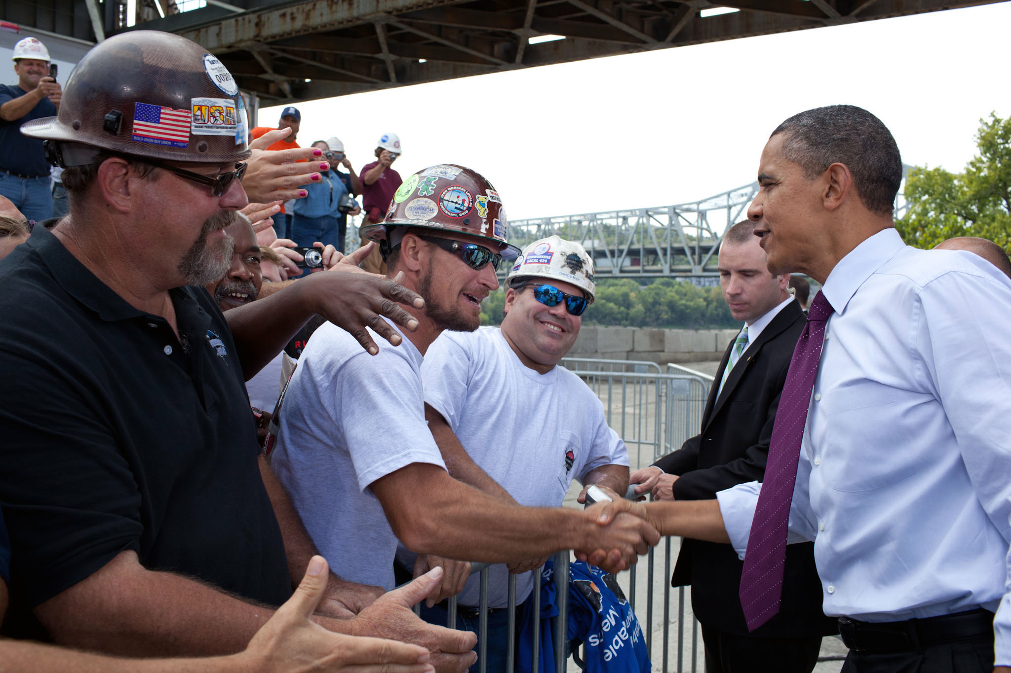 President Barack Obama shakes hands with Construction Workers