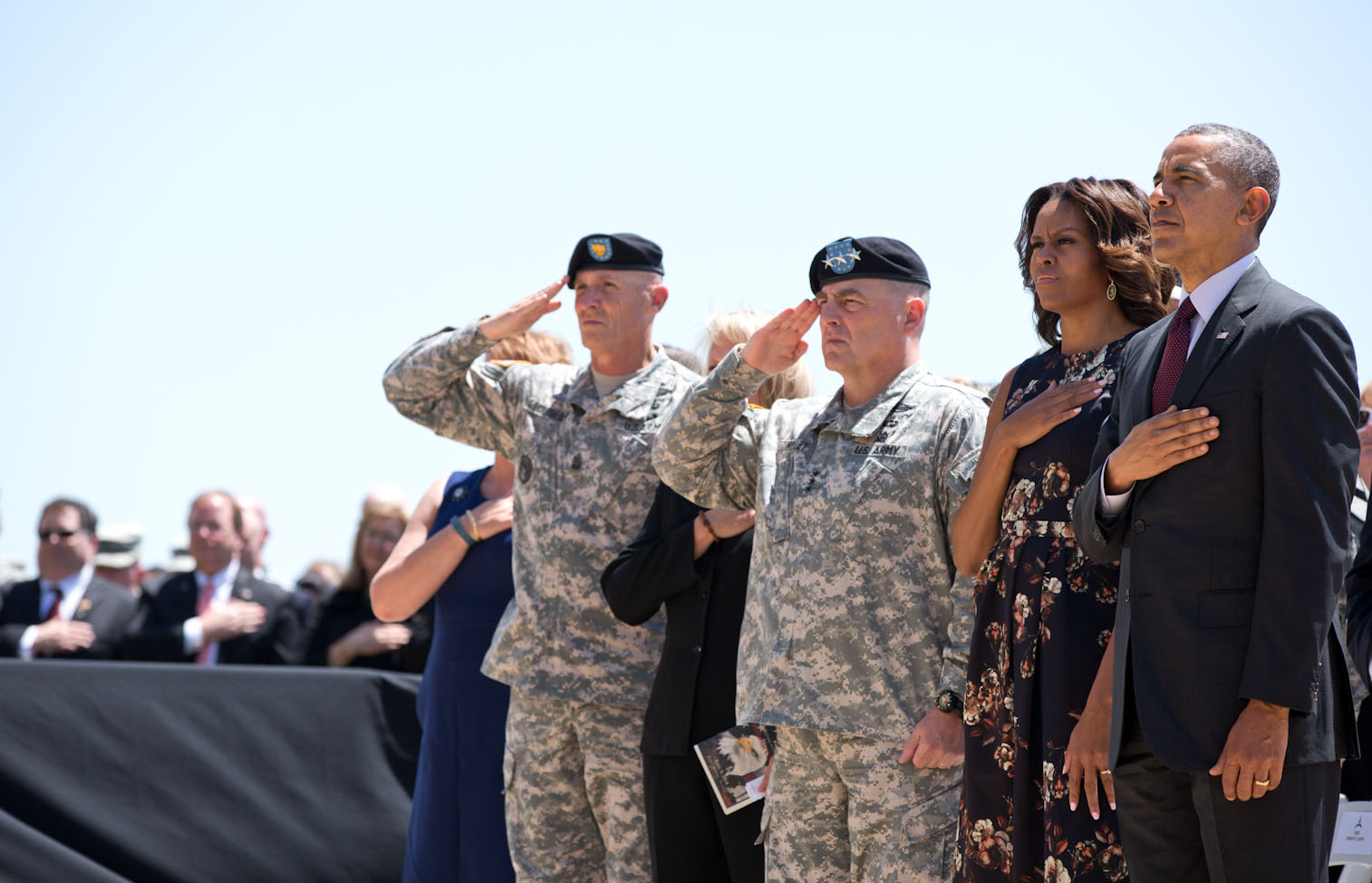 President Barack Obama and First Lady Michelle Obama join other officials during a memorial service for the victims of the Fort Hood shootings, at Fort Hood in Killeen, Texas