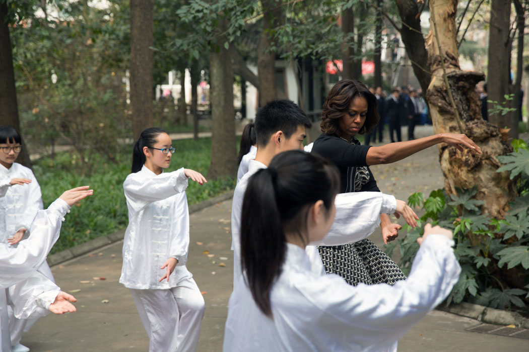 First Lady Michelle Obama participates in Tai Chi with students from Number 7 School in Chengdu