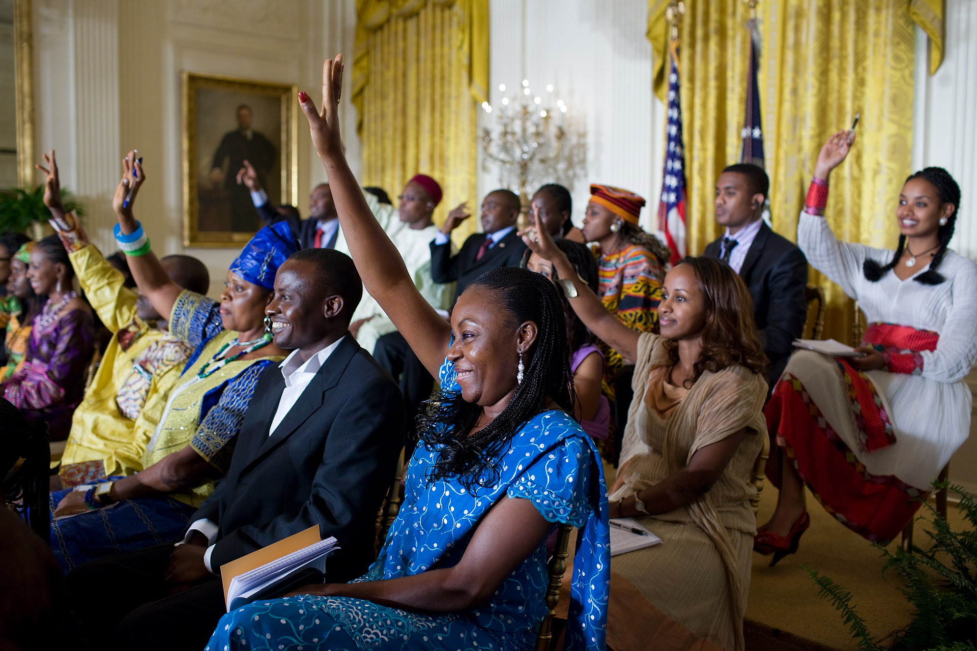 Young African Leaders Raise Their Hands at a White House Forum 