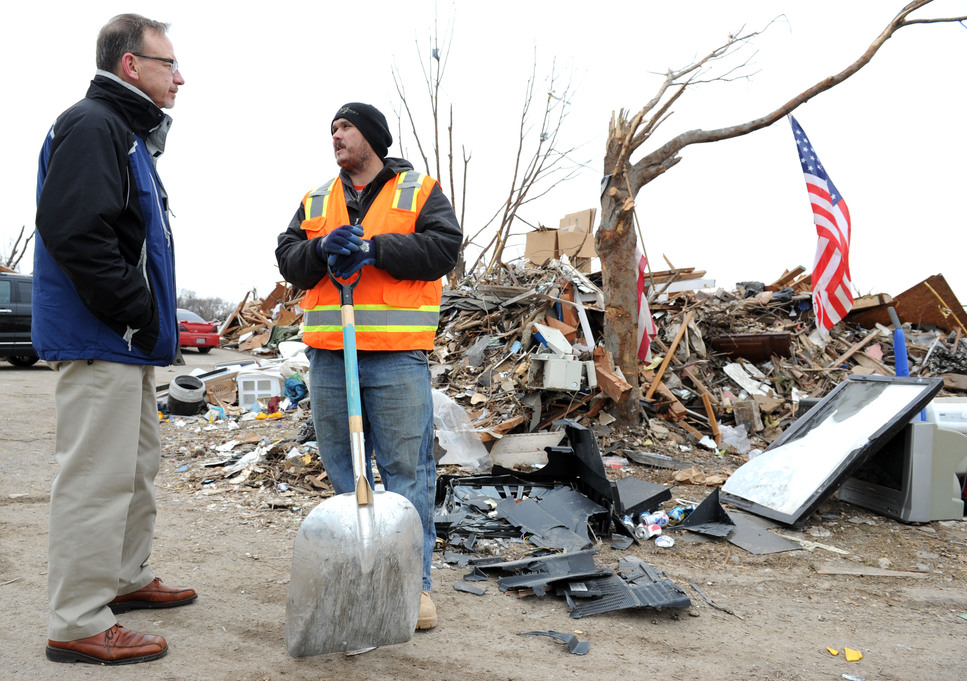 Rev. David Myers, left, Senior Advisor to the FEMA Administrator/Director Center of Faith-based & Neighborhood Partnerships, speaks to First Baptist Church Pastor Joshua Monda