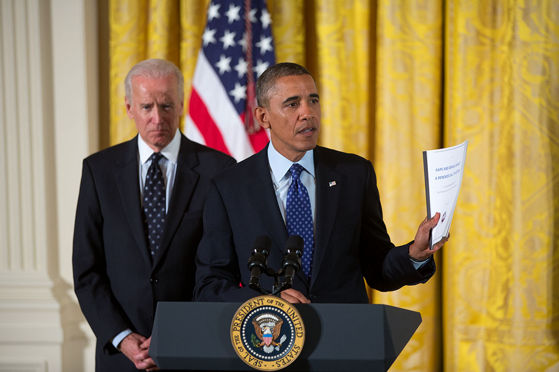 President Barack Obama, with Vice President Joe Biden, delivers remarks during a White House Council on Women and Girls meeting in the East Room of the White House, Jan. 22, 2014.