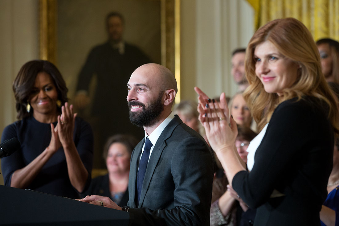 First Lady Michelle Obama and Connie Britton applaud as Counselor of the Year Cory Notestine delivers remarks