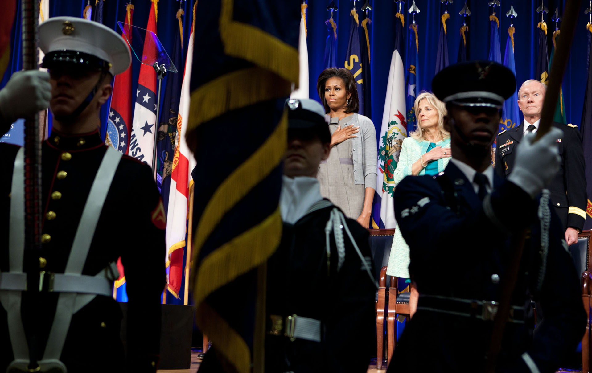 First Lady Michelle Obama And Dr. Jill Biden Stand For The National Anthem