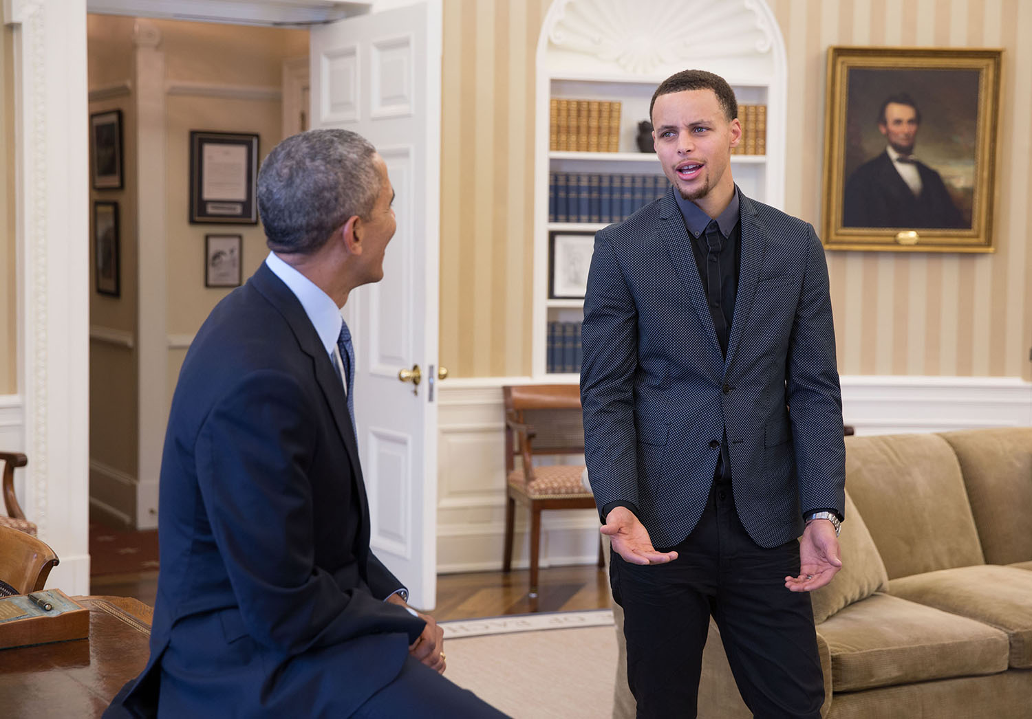 President Obama visits with Golden State Warriors point guard Stephen Curry