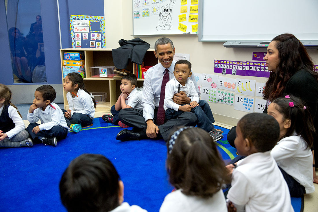 President Barack Obama talks with students during a classroom visit at Powell Elementary School in Washington, D.C