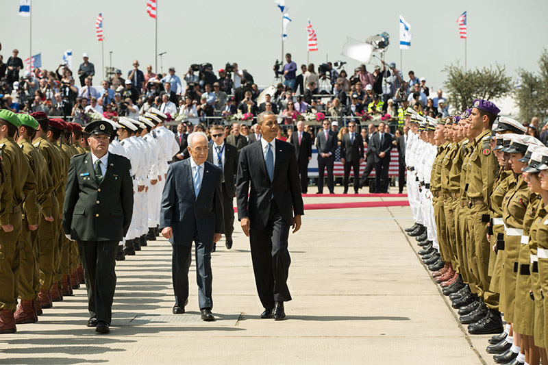 President Obama and Israeli President Peres inspect an honor guard in Tel Aviv, Israel, March 20, 2013