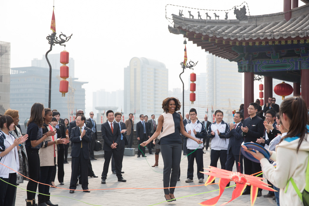 First Lady Michelle Obama jumps rope on her visit to the Xi'an City Wall with Sasha, Malia and Marian Robinson in Xi'an, China