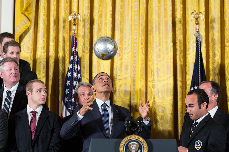 President Obama tosses a soccer ball as he welcomes the LA Kings and the LA Galaxy to the White House, March 26, 2013