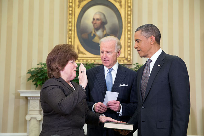 President Obama watches as Vice President Joe Biden administers the oath of office to incoming U.S. Secret Service Director Julia Pierson, March 27, 2013.