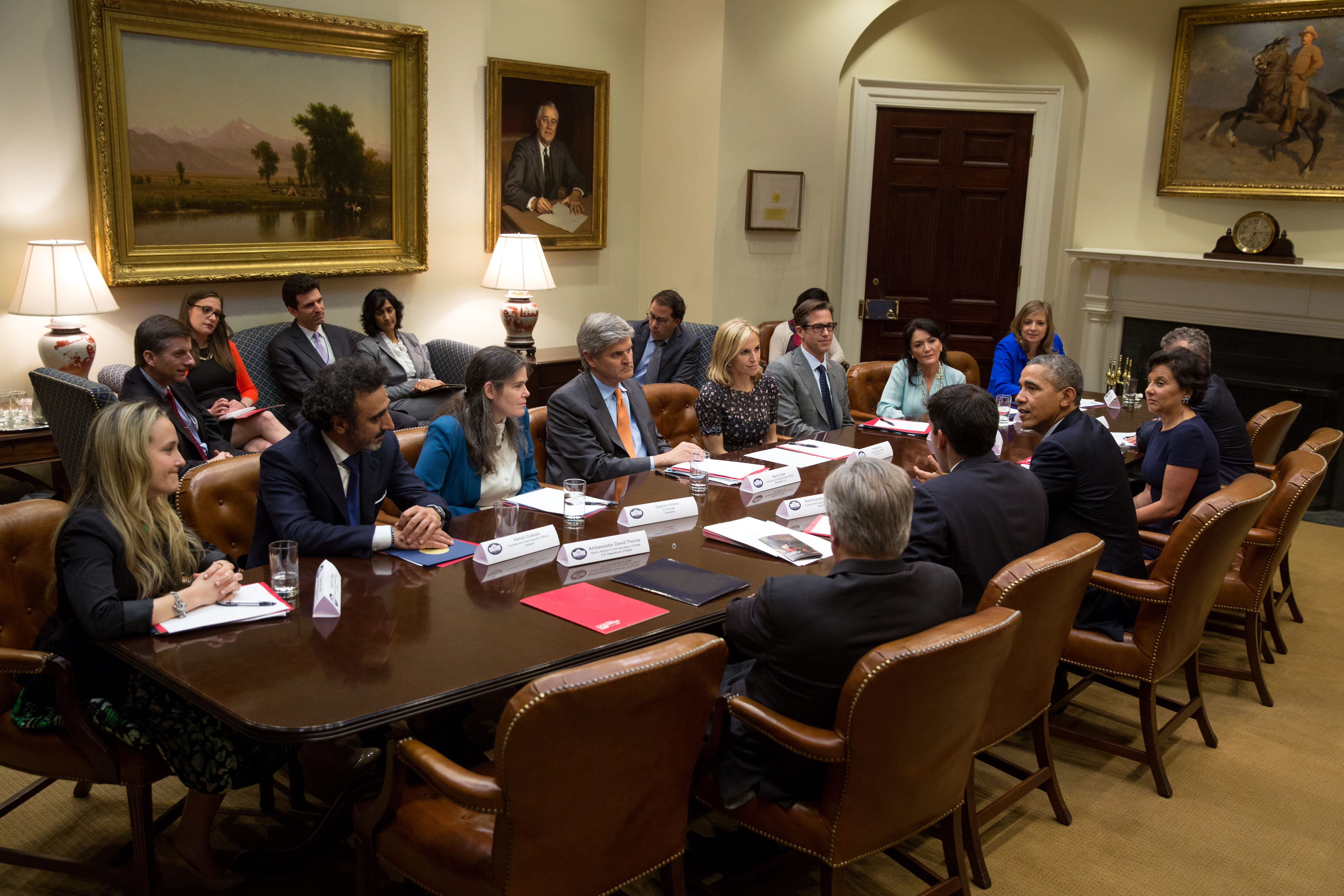 President Barack Obama drops by the first meeting of the Presidential Ambassadors for Global Entrepreneurship, with Commerce Secretary Penny Pritzker, in the Roosevelt Room of the White House