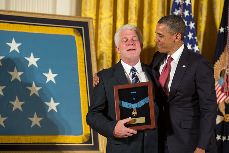 President Obama embraces Ray Kapaun after presenting him with the Medal of Honor awarded to his uncle, Chaplain Emil J. Kapaun, April 11, 2013.