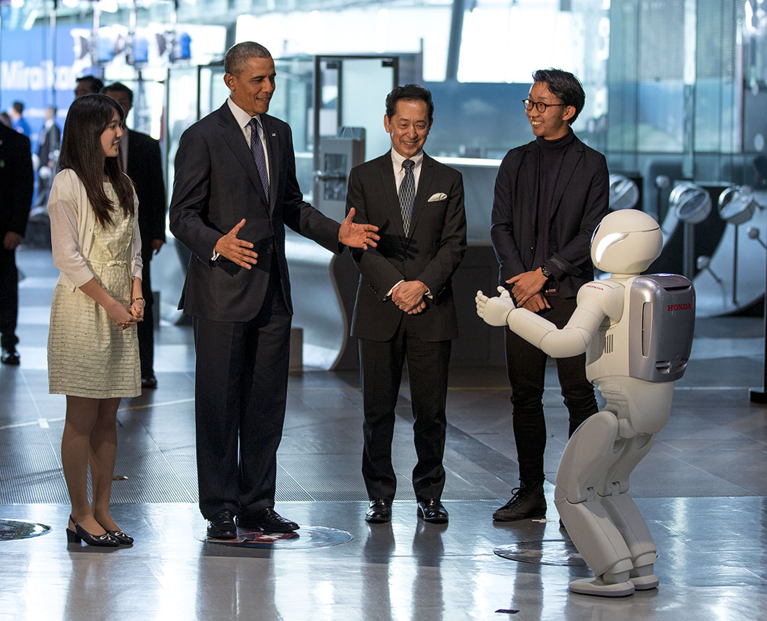 President Barack Obama takes interacts with a robot during a tout at the National Museum of Emerging Science and Innovation (Miraikan), in Tokyo, Japan
