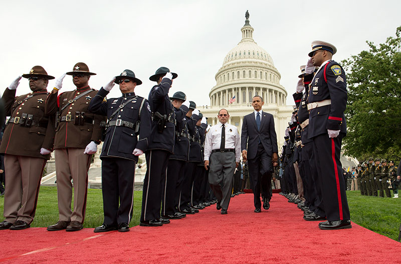 President Barack Obama and Chuck Canterbury, National President, Fraternal Order of Police (FOP) walk through a police honor guard cordon