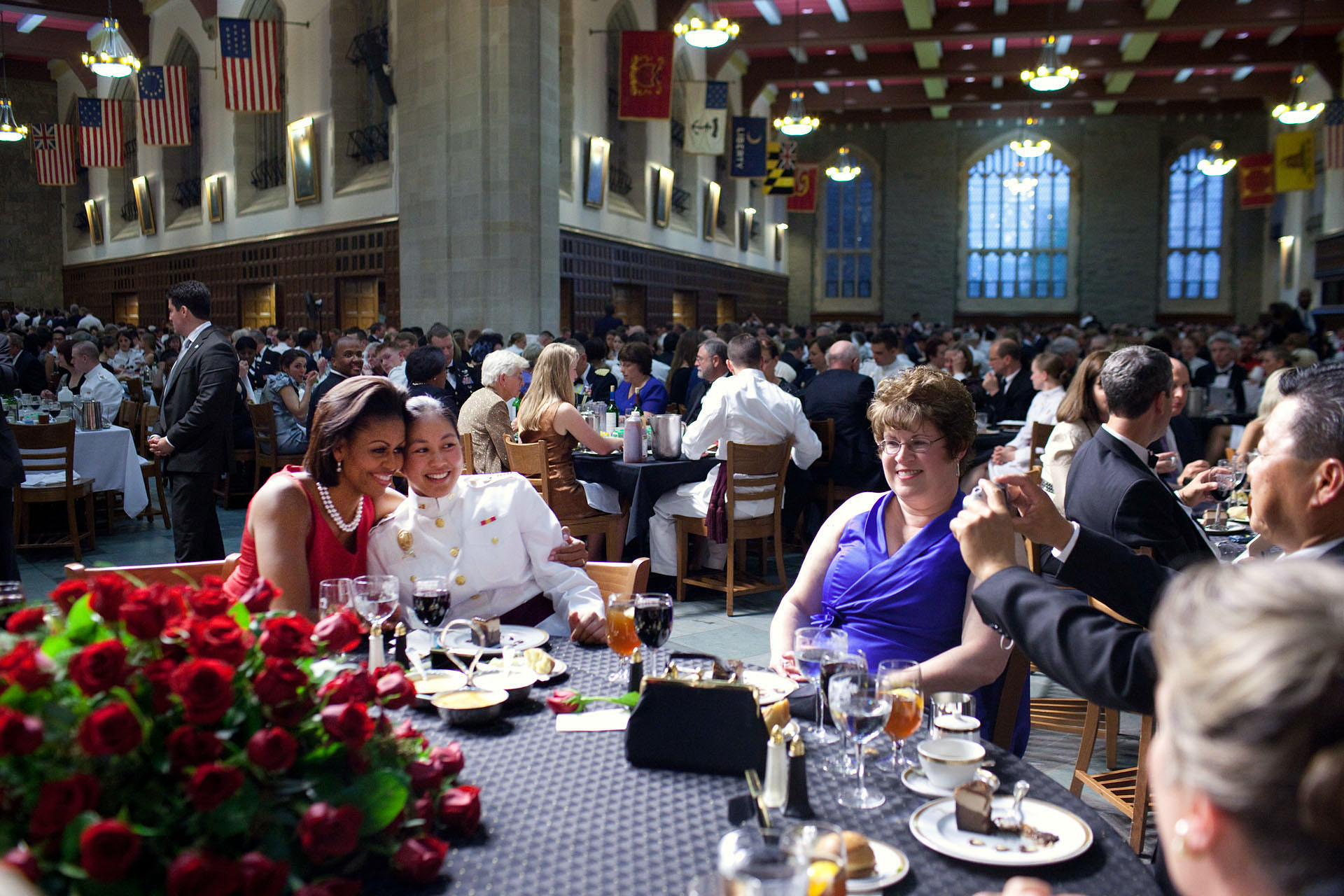 First Lady Michelle Obama poses for a photo while attending the West Point Graduation Banquet