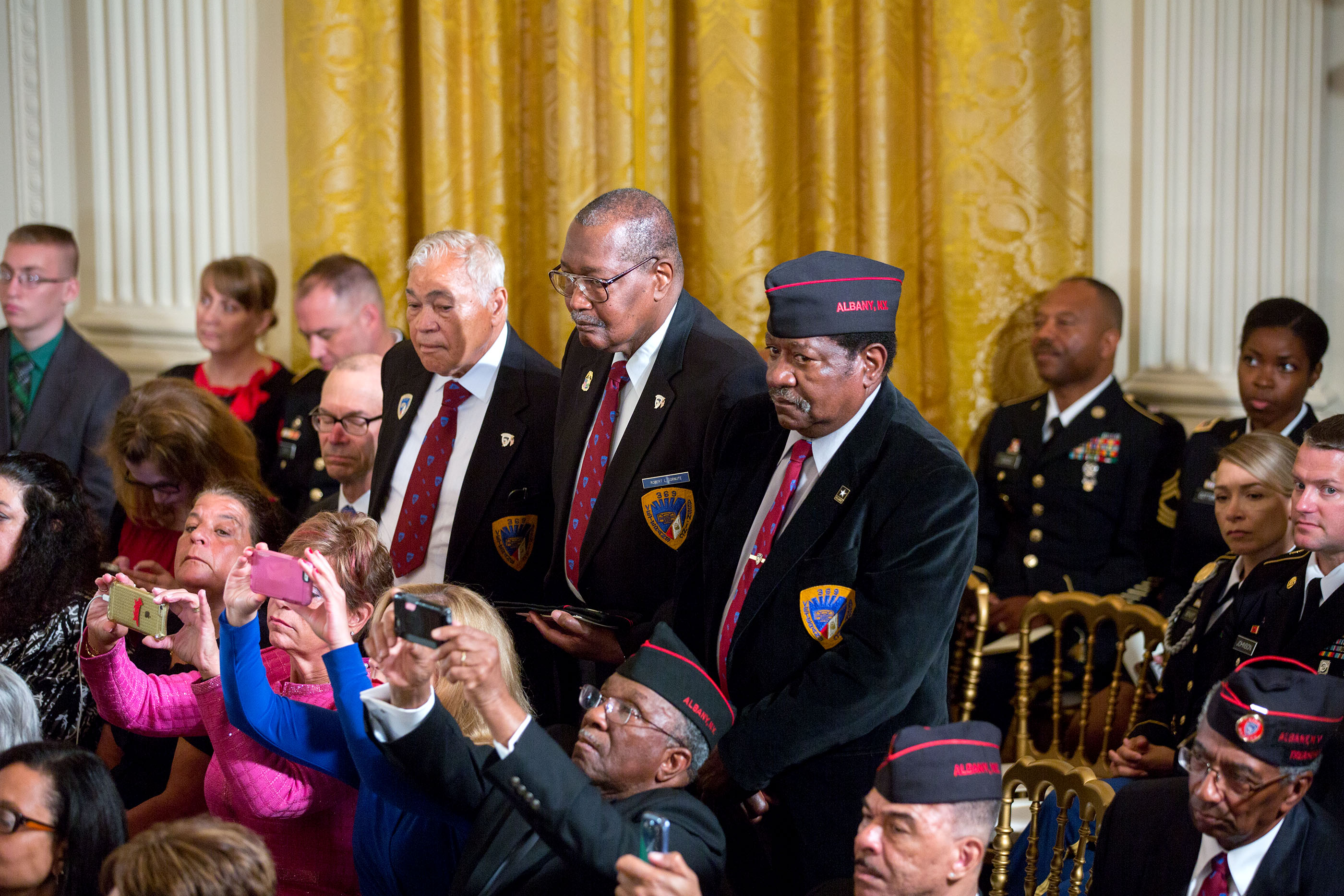 Members of the 369th Infantry Regiment Veterans Association stand as President Barack Obama awards the Medal of Honor posthumously to Army Private Henry Johnson for conspicuous gallantry during World War I, at a ceremony in the East Room of the White Hous