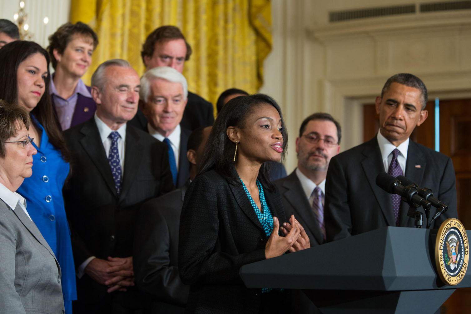 Tolu Olubunmi introduces President Barack Obama before his remarks on immigration reform