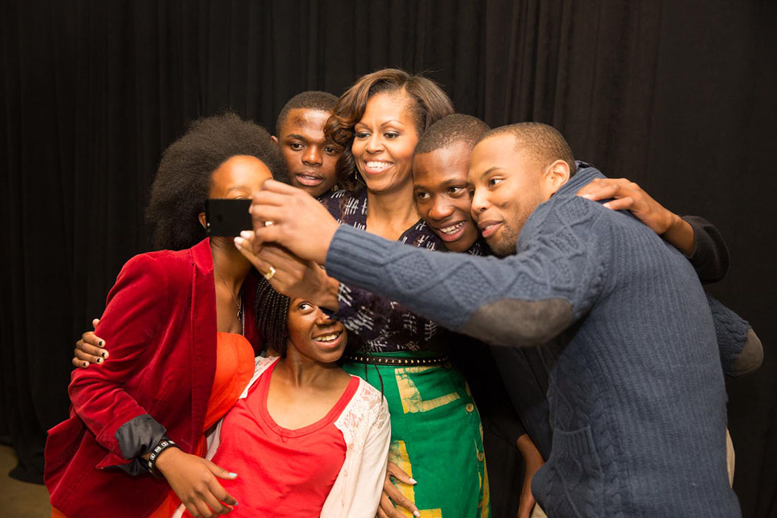 First Lady Michelle Obama and stage participants take a group photo