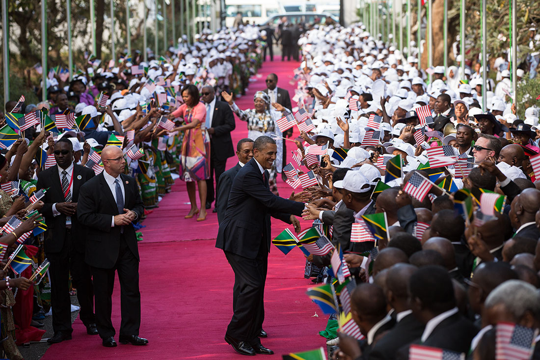 President Barack Obama and First Lady Michelle Obama shake hands as they arrive at the State House in Dar es Salaam, Tanzania