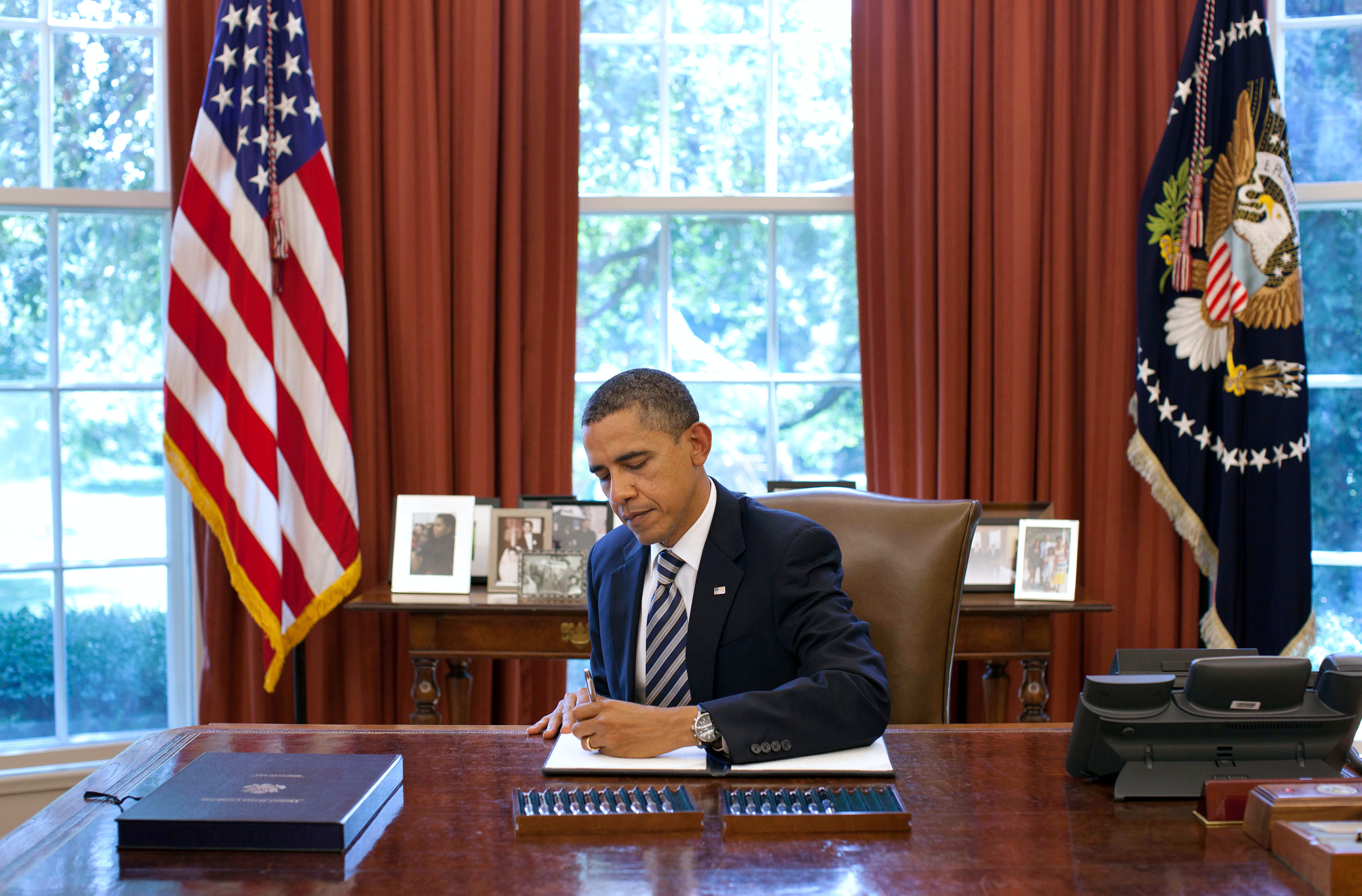 President Barack Obama Signs The Budget Control Act Of 2011