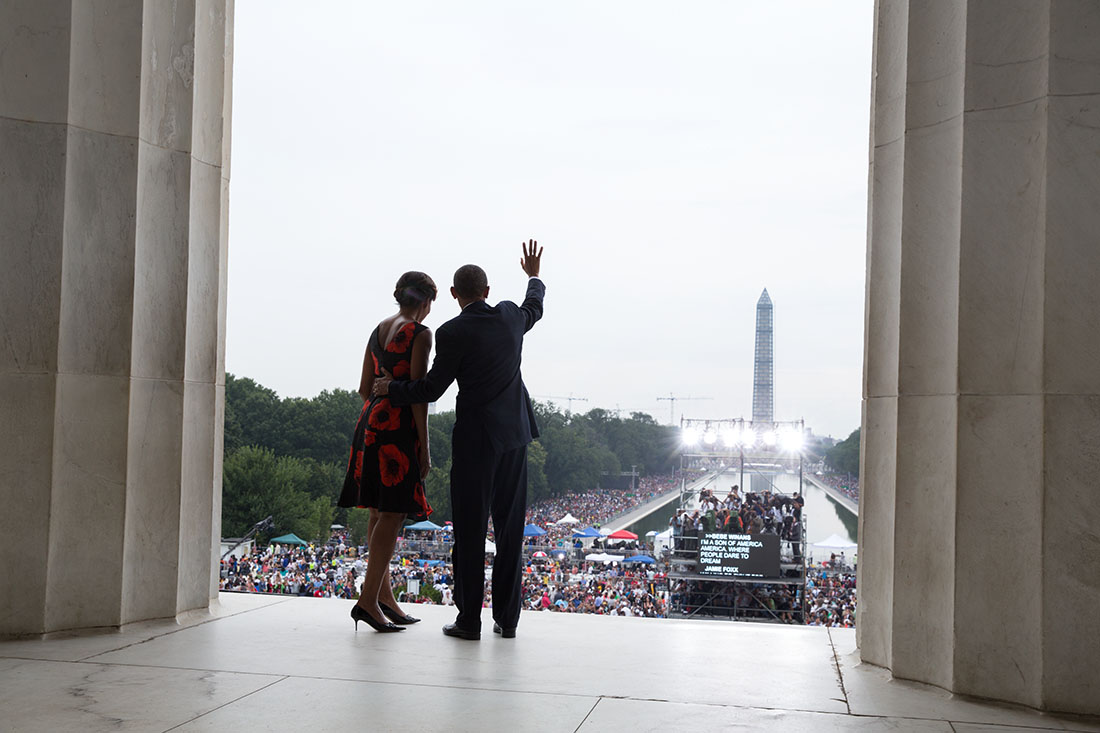 President Barack Obama and First Lady Michelle Obama wave to the crowd at the end of the Let Freedom Ring ceremony