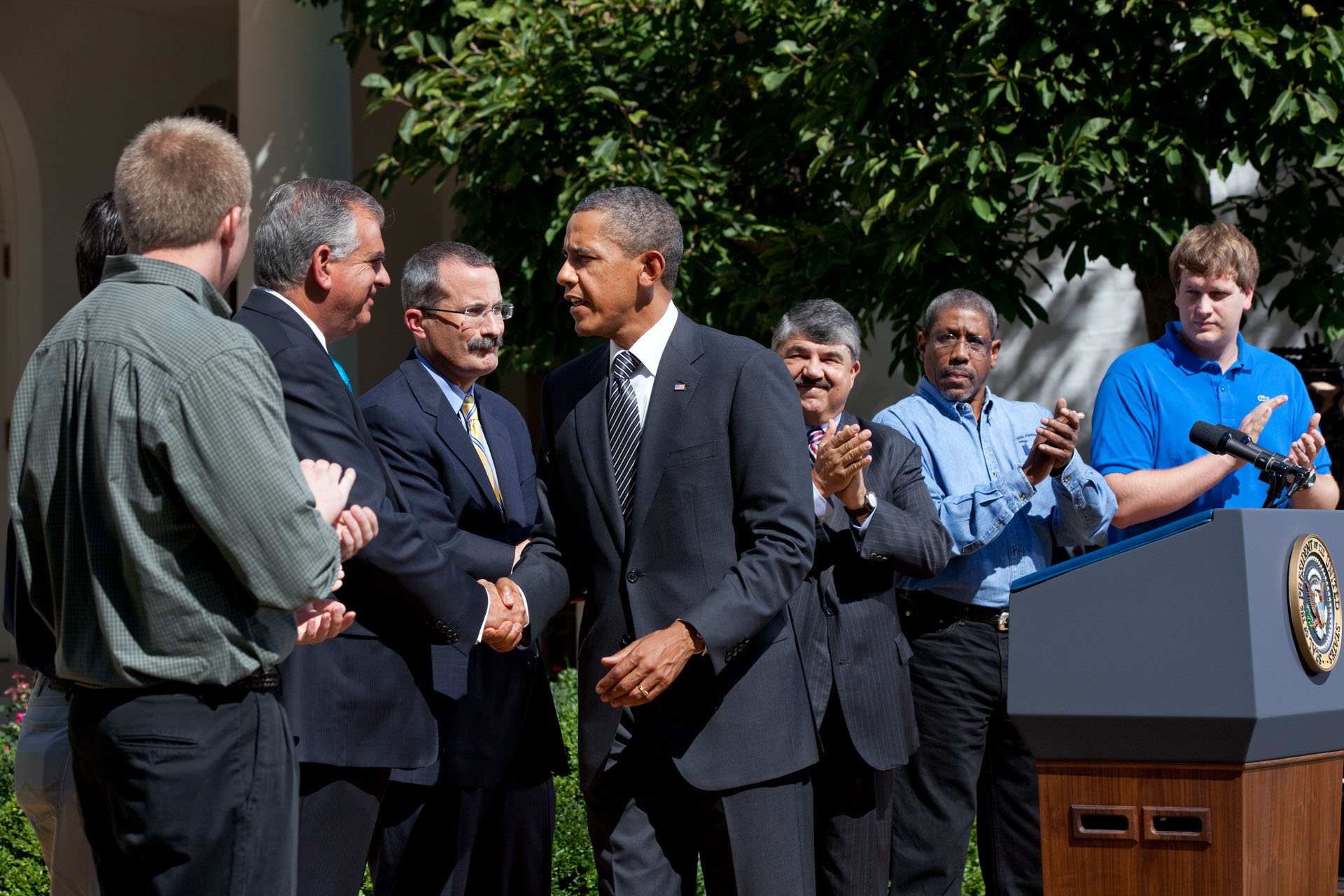 President Obama shakes hands with Transportation Secretary Ray LaHood after a statement on the Surface Transportation Bill