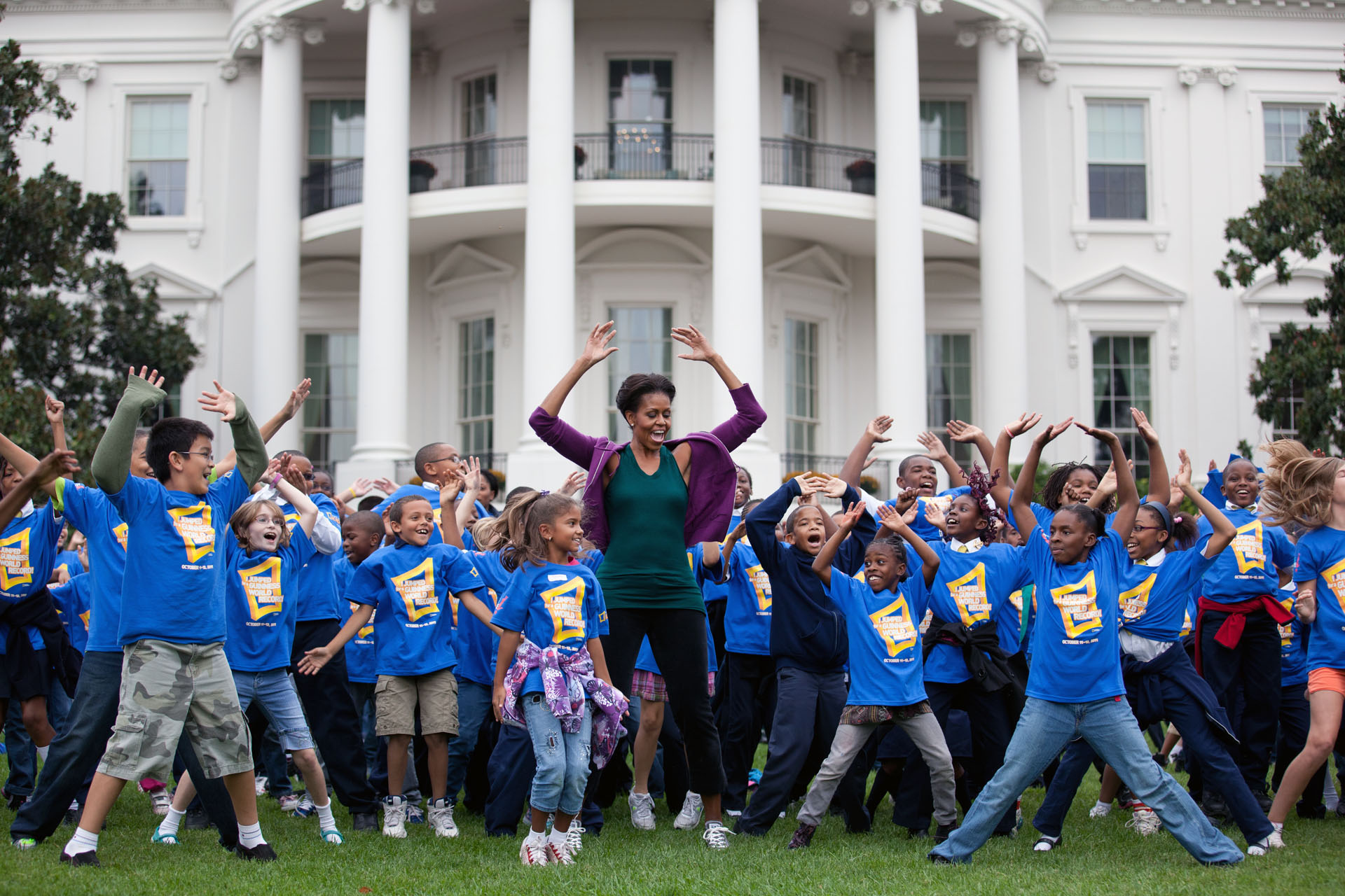 First Lady Michelle Obama leads Jumping Jacks to help break the Guinness Record