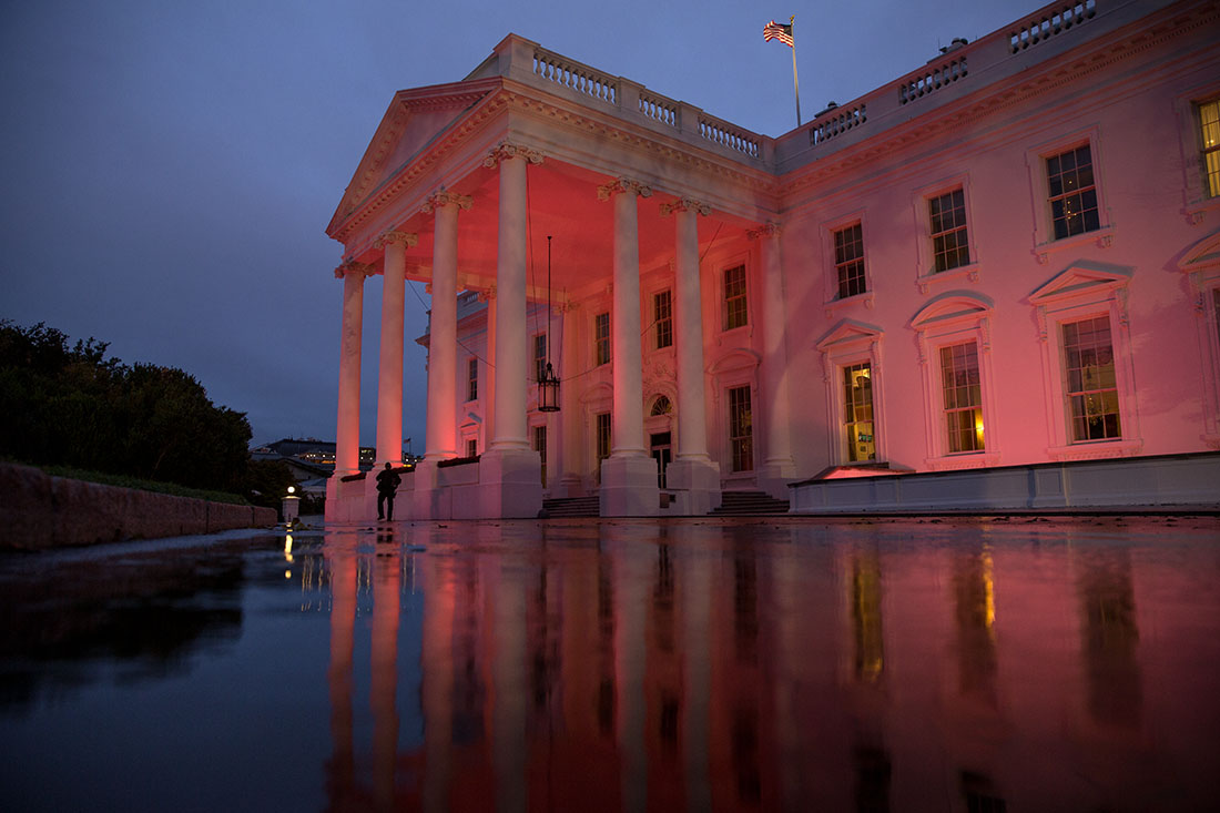 The North Portico exterior of the White House is illuminated pink in honor of Breast Cancer Awareness Month, Oct. 15, 2014