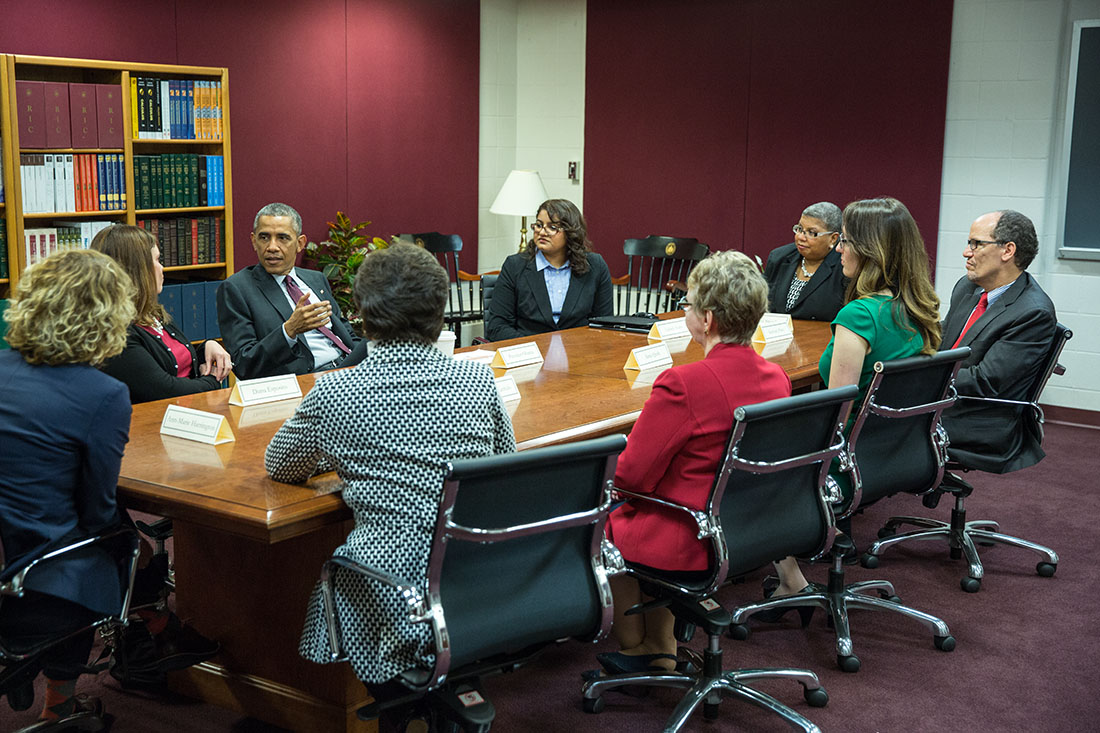 President Barack Obama holds a women's roundtable discussion prior to remarks on the economy at Rhode Island College in Providence, Rhode Island, Oct. 31, 2014. Labor Secretary Thomas Perez attends at right.