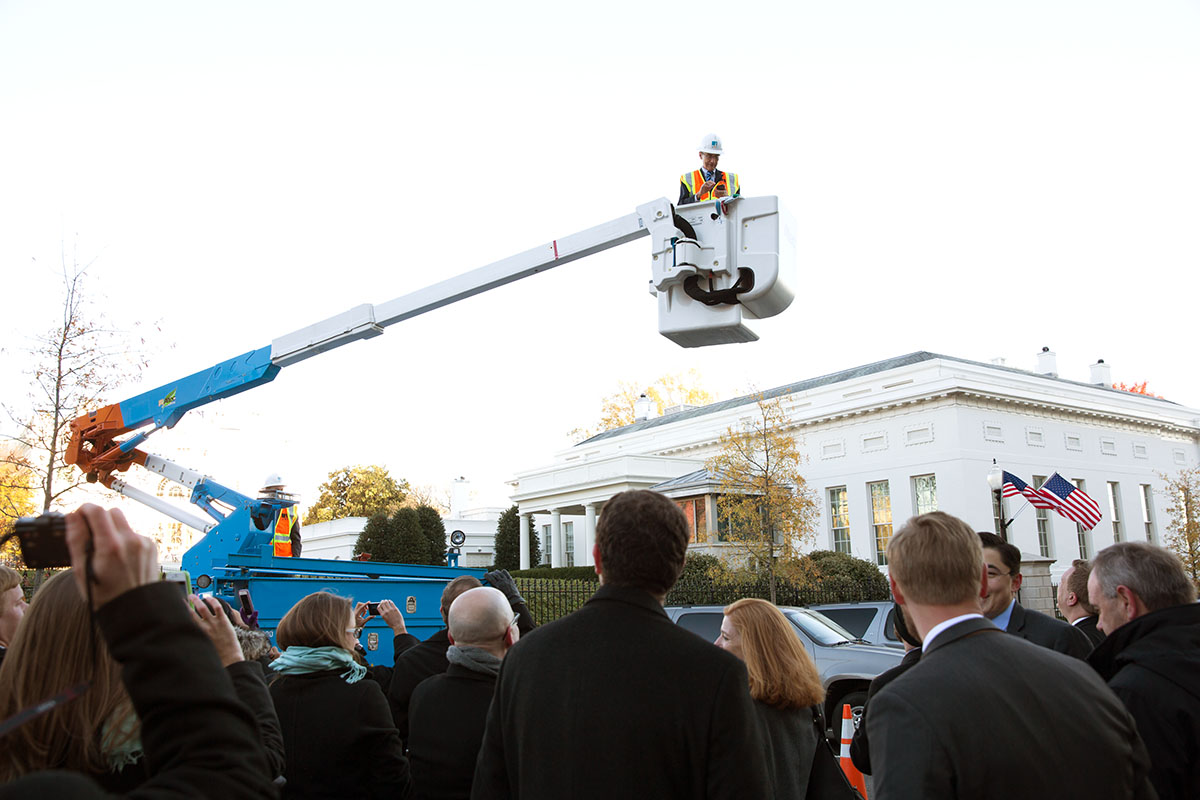 John Podesta operates the bucket on the new hybrid hydraulic lift power trucks on West Executive Dr.