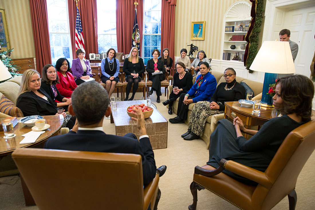 President Barack Obama and First Lady Michelle Obama meet with mothers regarding the Affordable Care Act in the Oval Office