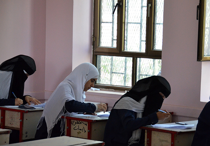 Girls at the Al-Jeel Al-Jadeed School in Sana’a, Lebanon, begin their exams on test day