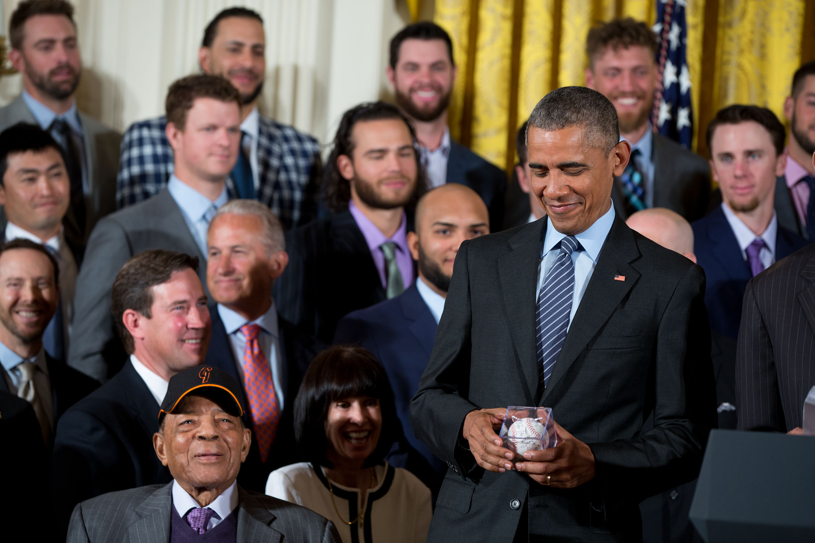 President Obama holds a Giants baseball 