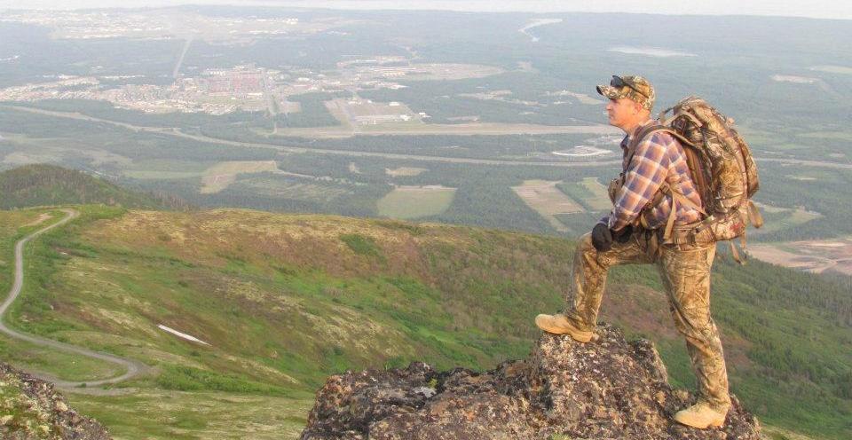 SFC Jason Folmar poses above Arctic Valley