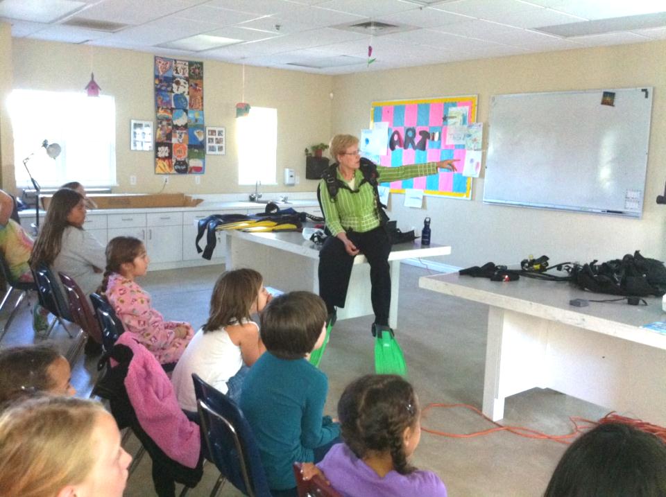 Dr. Jane Lubchenco demonstrates an ocean explorer’s toolkit to students 