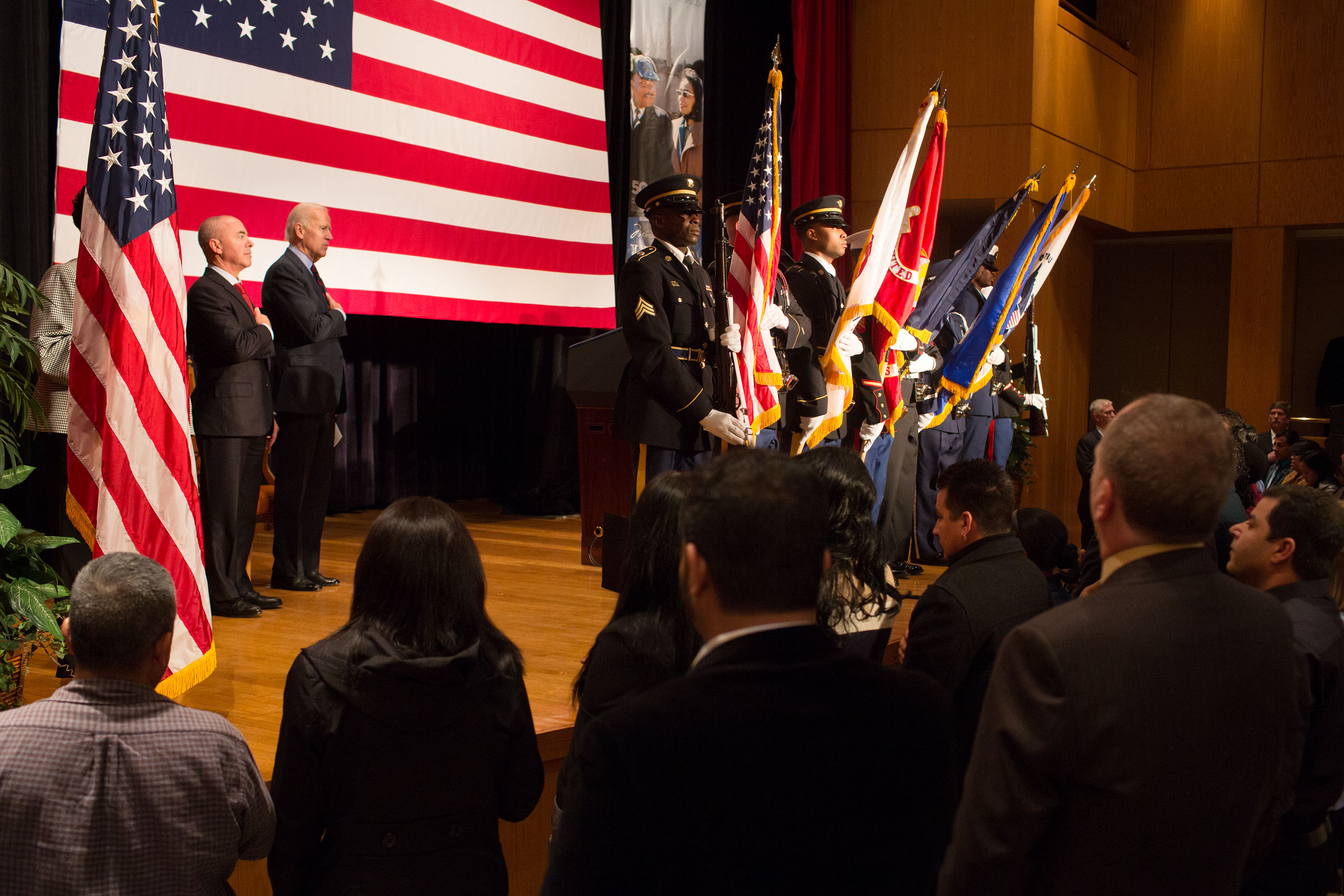 Vice President Joe Biden and U.S. Citizenship and Immigration Services Director Alejandro Mayorkas stand for the National Anthem