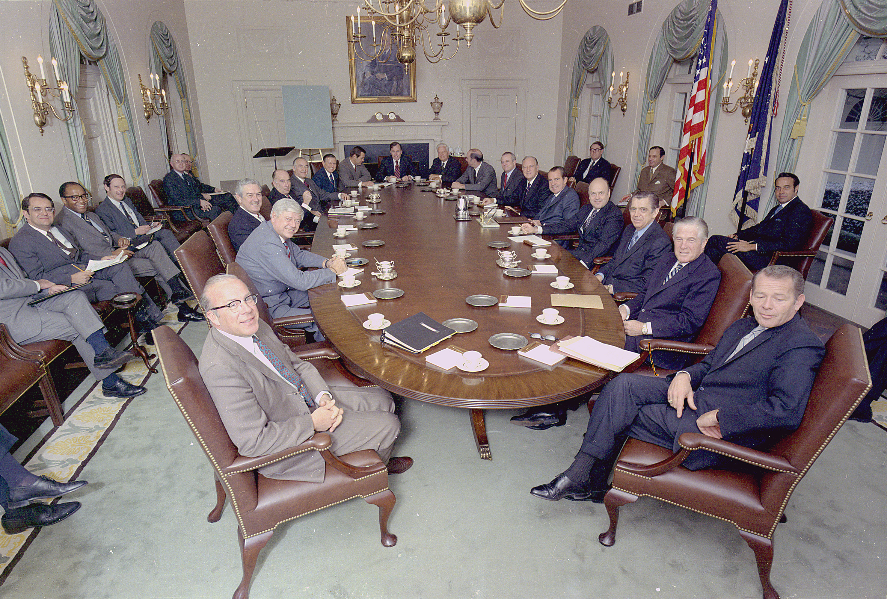 Richard M. Nixon posing with his cabinet in the cabinet room in the White House.